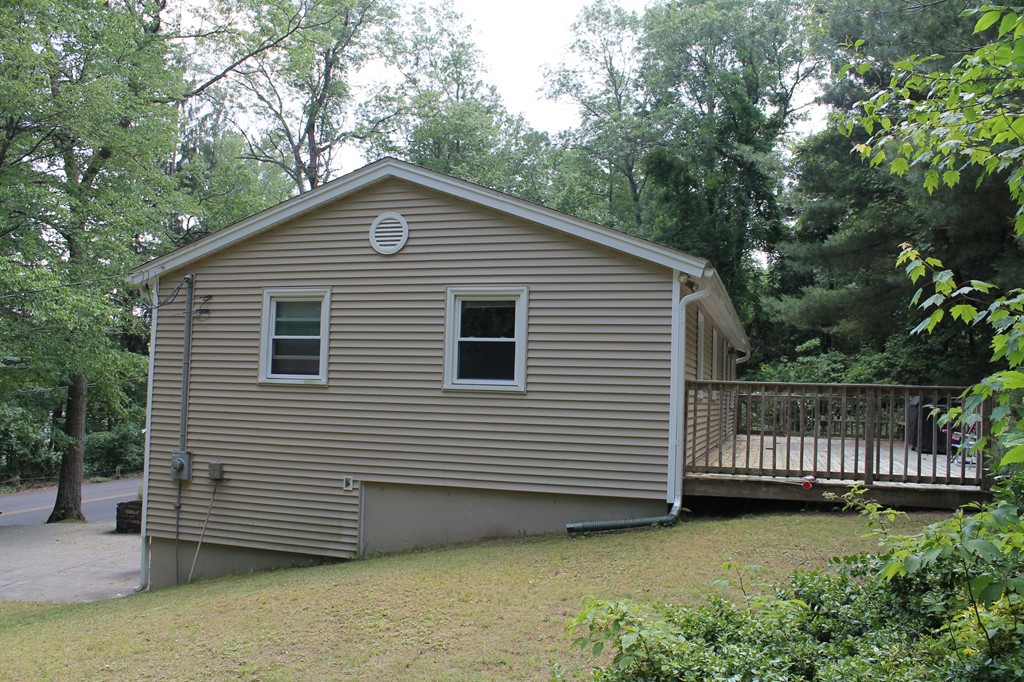 230 West Sutton Road Sutton, MA 01590 - Photo 3 of 28 a front view of a house with a garden