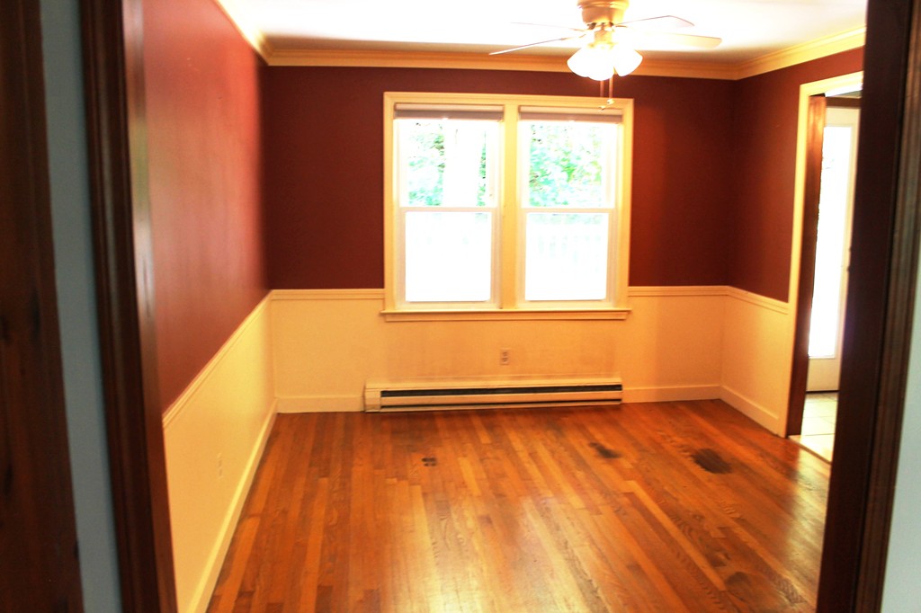 230 West Sutton Road Sutton, MA 01590 - Photo 10 of 28 a view of an empty room with a window and wooden floor