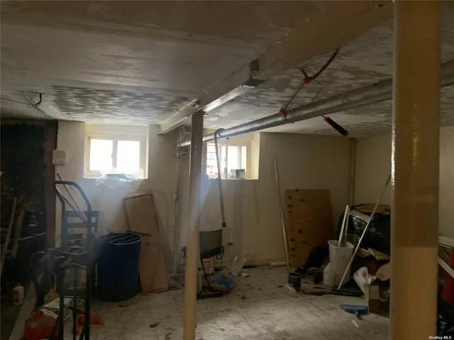 a front view of a residential apartment building with parking space