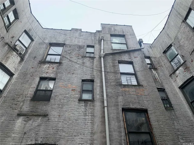 a aerial view of a brick building with many windows