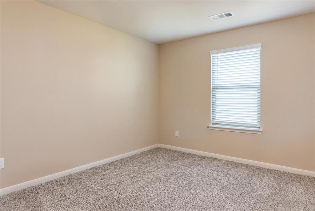 216 Lake Ridge Princeton, TX 75407 - Photo 12 of 20 an empty room with a window