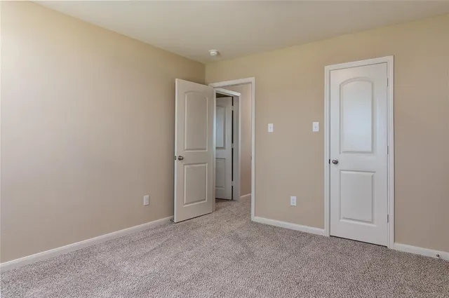 an empty room with closet area