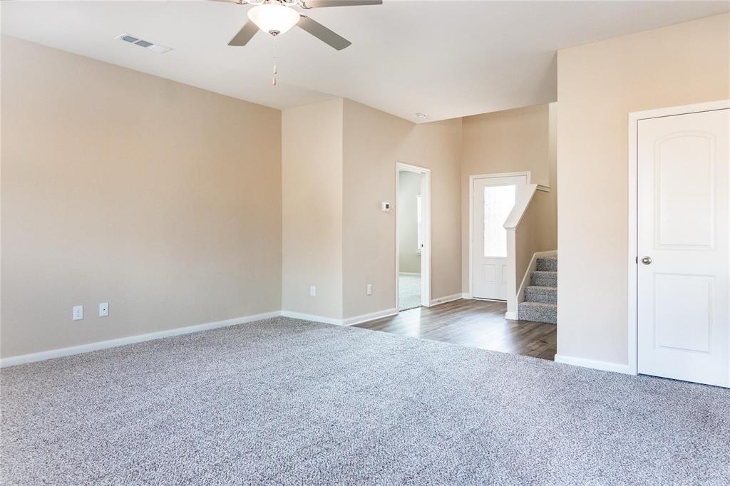 216 Lake Ridge Princeton, TX 75407 - Photo 15 of 20 an empty room with a ceiling fan and a window
