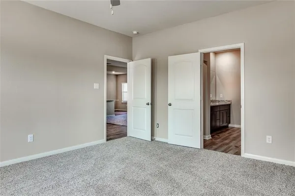 a view of a hallway with wooden cabinet and a fireplace