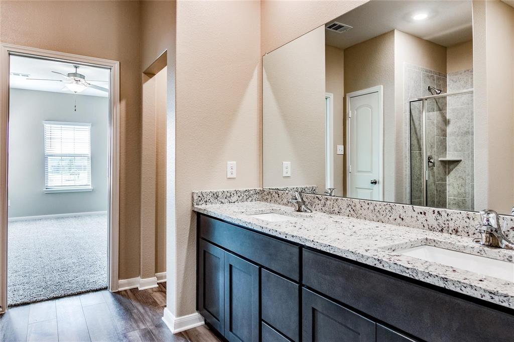 216 Lake Ridge Princeton, TX 75407 - Photo 17 of 20 a bathroom with a granite countertop sink and a mirror