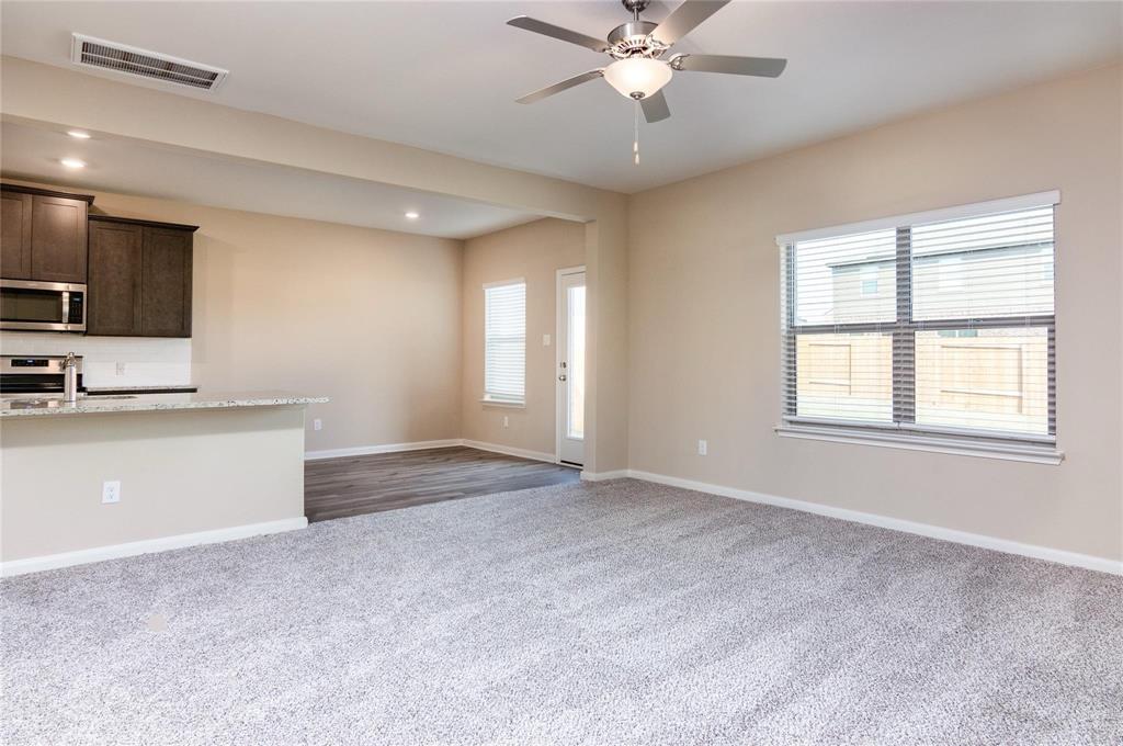 216 Lake Ridge Princeton, TX 75407 - Photo 2 of 20 a view of an empty room with window and cabinet