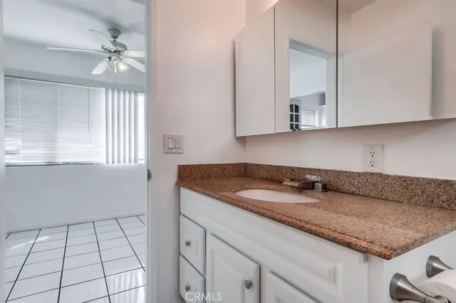 a kitchen with a sink cabinets and a stove