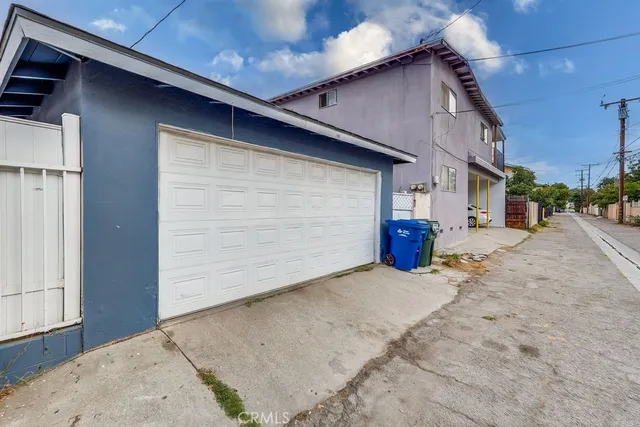a view of a house with a yard and deck