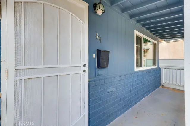 a view of entryway with wooden floor