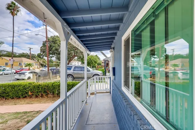 a view of balcony with wooden floor