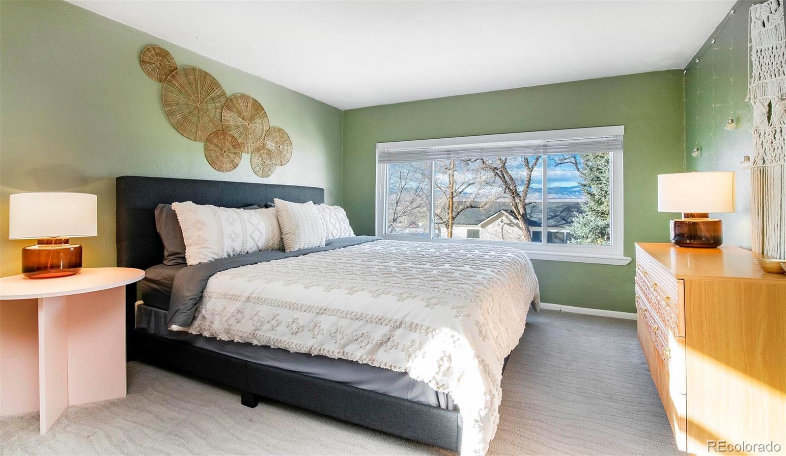 6480 Garrison Street Arvada, CO 80004 - Photo 16 of 40 a bedroom with a bed and a window