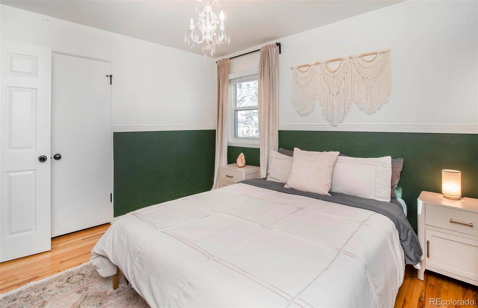 6480 Garrison Street Arvada, CO 80004 - Photo 24 of 40 a bedroom with a bed and a window