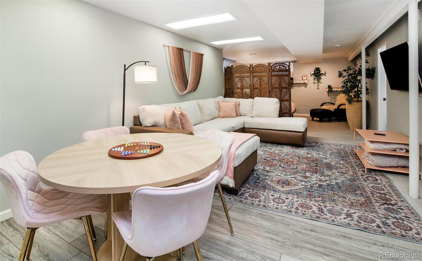 6480 Garrison Street Arvada, CO 80004 - Photo 25 of 40 a view of a dining room with furniture