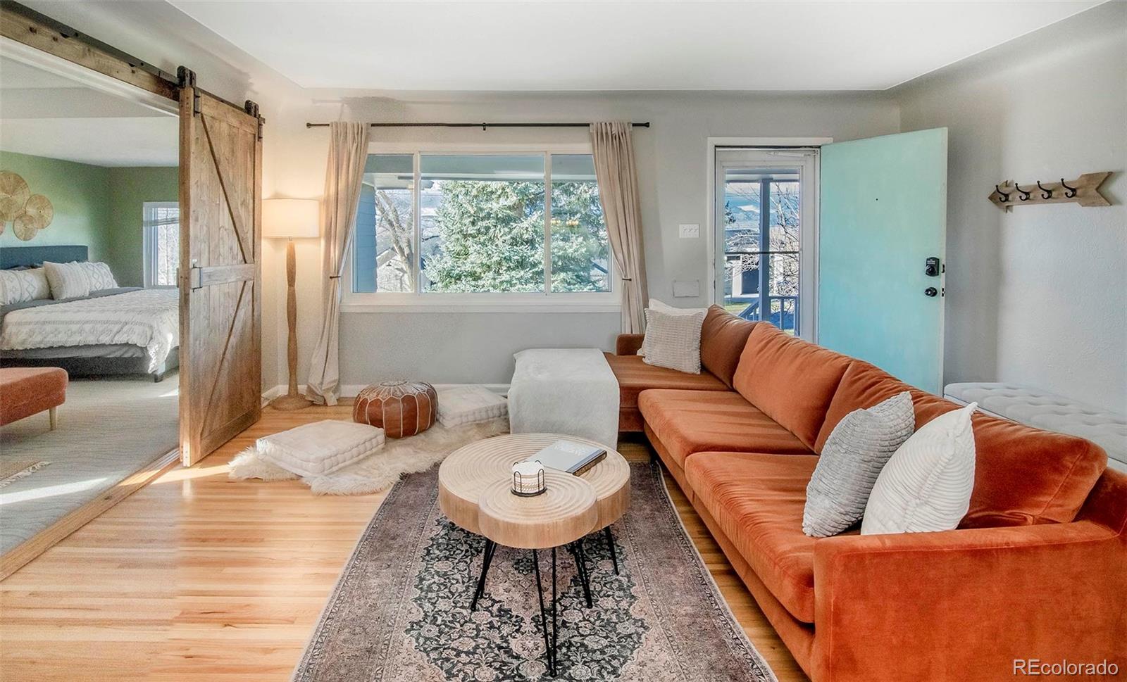 6480 Garrison Street Arvada, CO 80004 - Photo 6 of 40 a living room with furniture and a large window