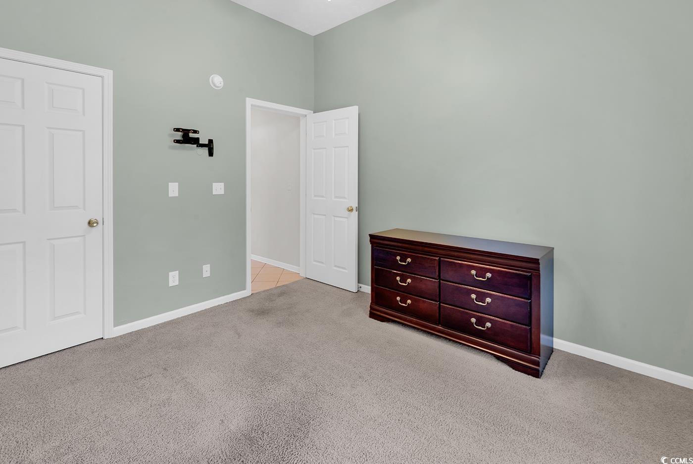 246 Catawba River Road Myrtle Beach, SC 29588 - Photo 15 of 27 Unfurnished bedroom featuring light carpet and baseboards