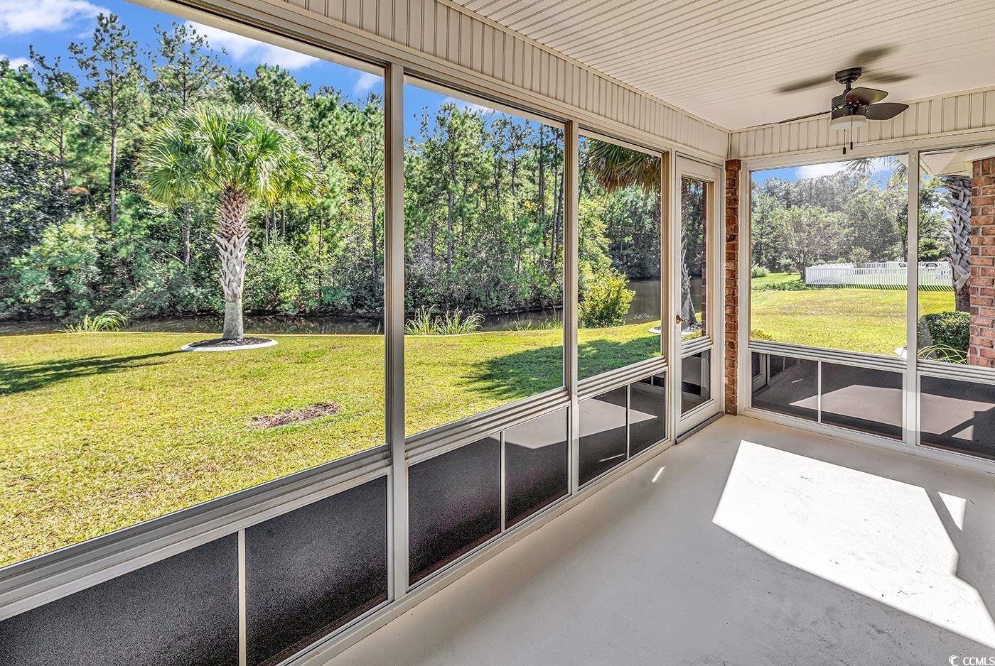 246 Catawba River Road Myrtle Beach, SC 29588 - Photo 22 of 27 Unfurnished sunroom featuring ceiling fan and view of wooded area