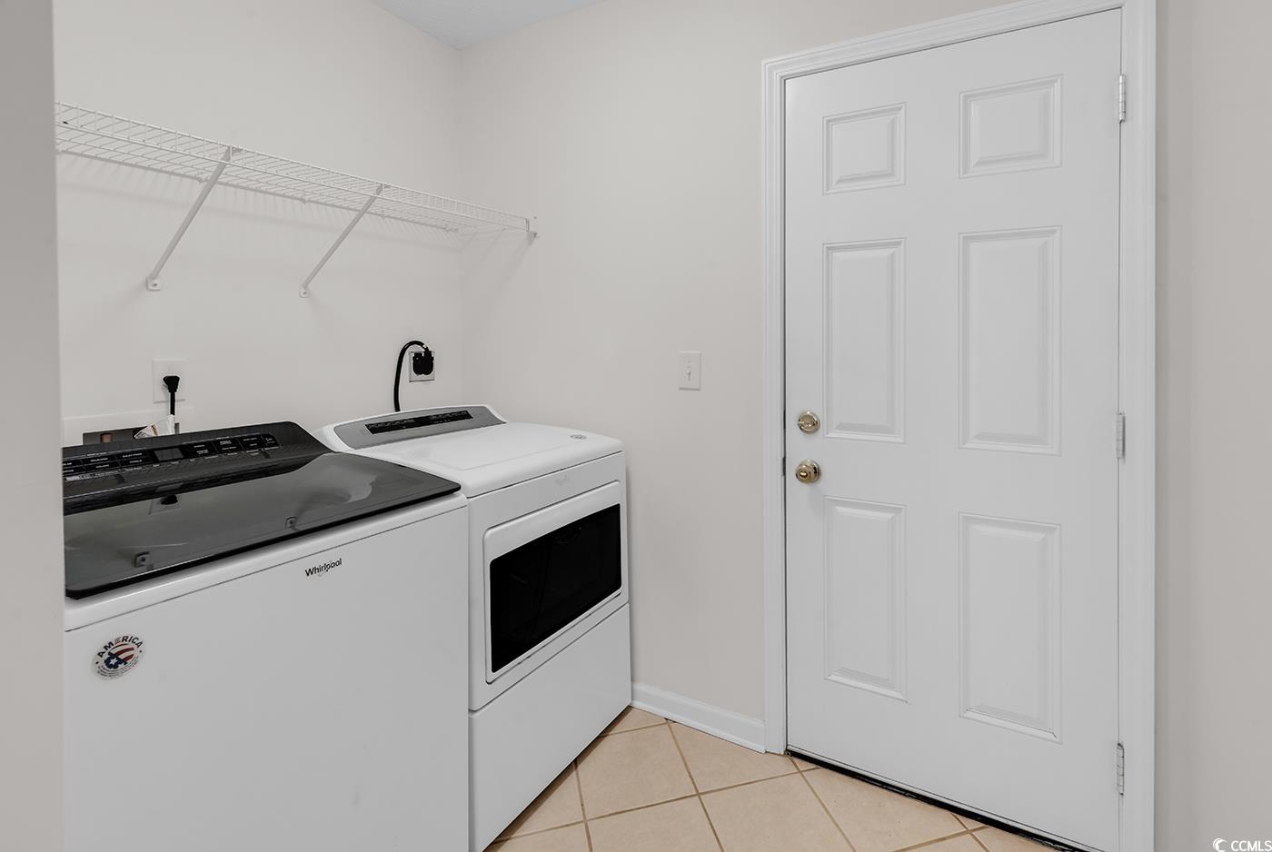 246 Catawba River Road Myrtle Beach, SC 29588 - Photo 8 of 27 Washroom featuring light tile patterned floors and washer and clothes dryer