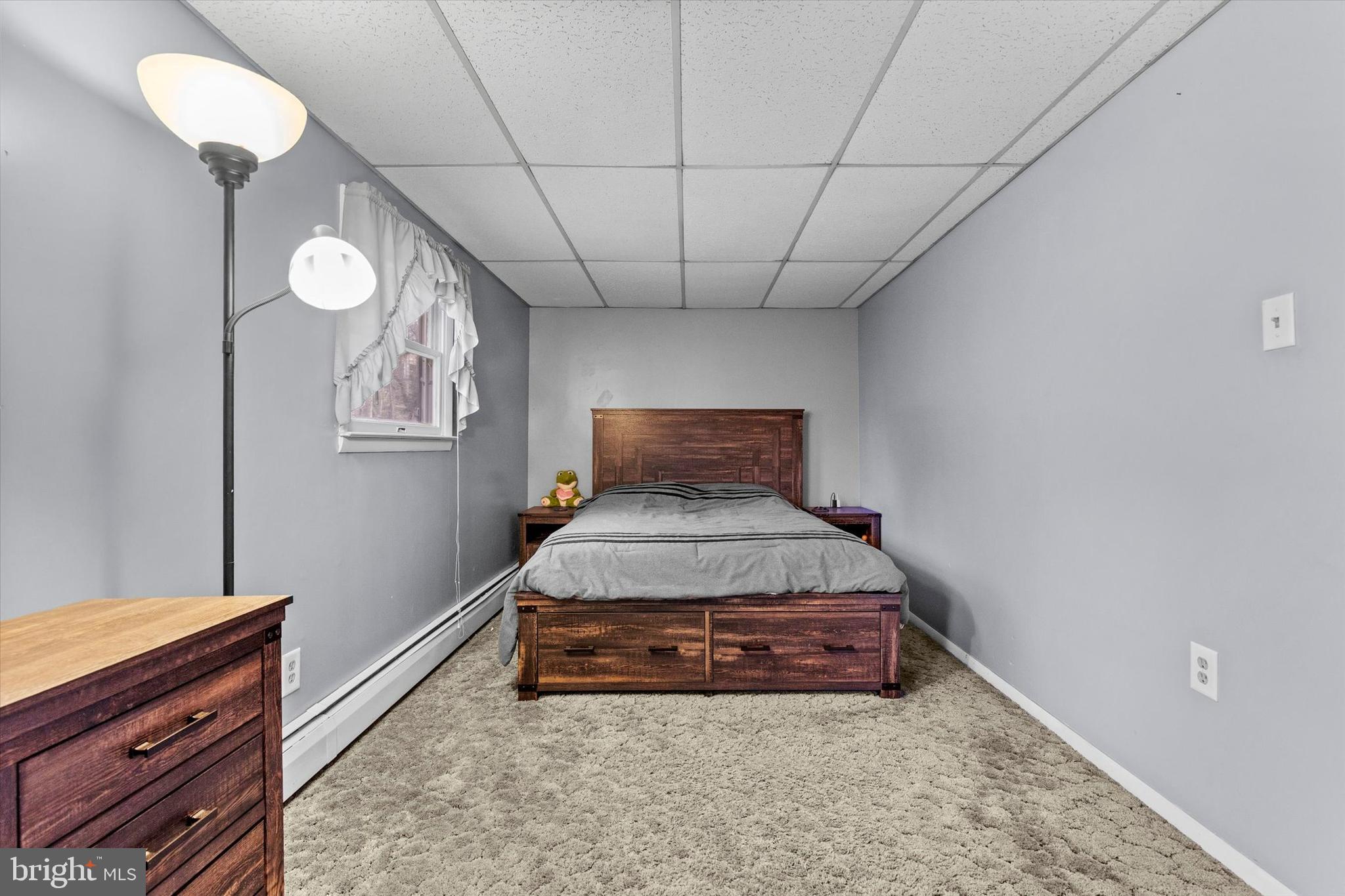 2689 Sheridan Road York, PA 17406 - Photo 13 of 28 a room with a bed and a chandelier