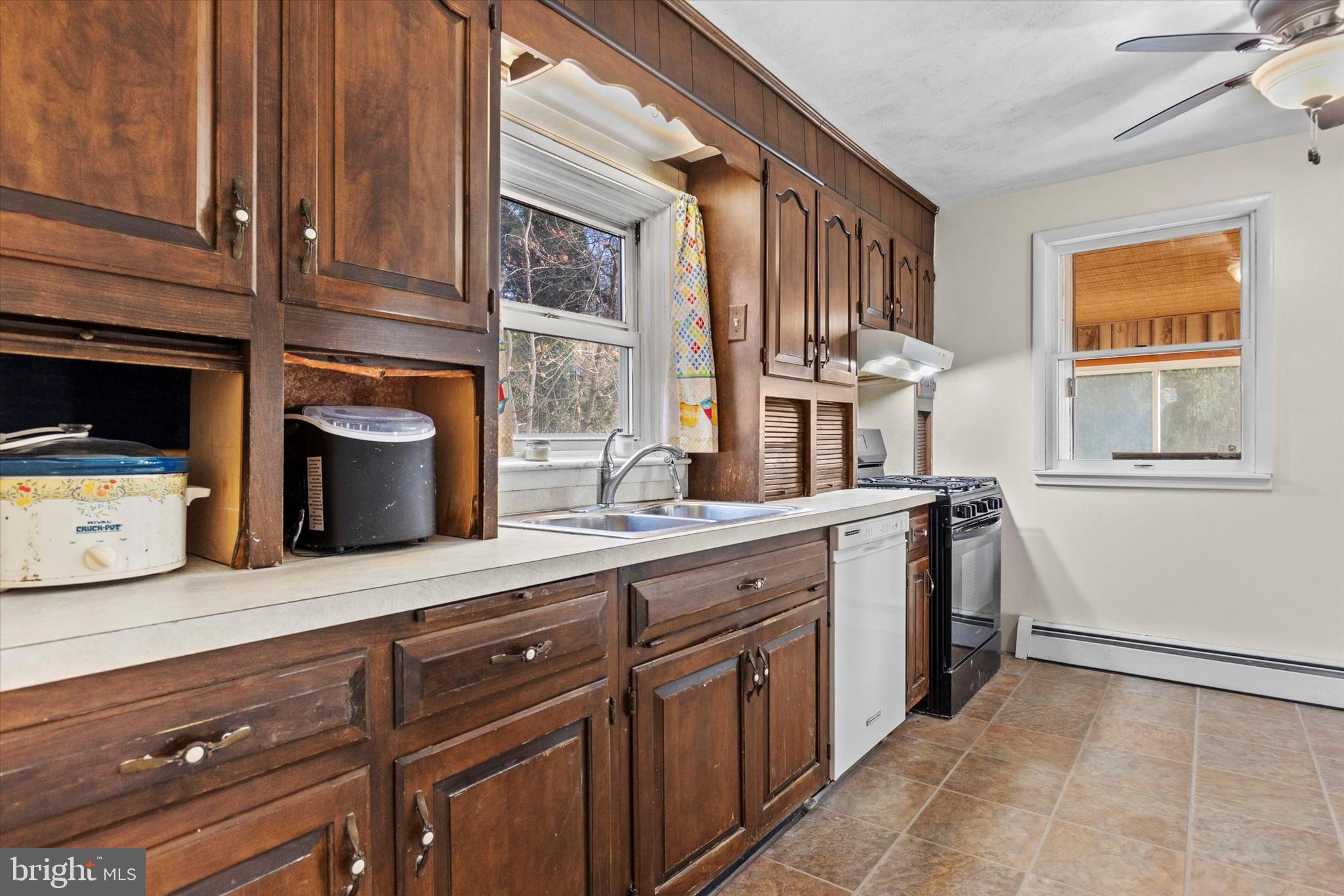 2689 Sheridan Road York, PA 17406 - Photo 15 of 28 a kitchen with stainless steel appliances granite countertop a stove and a sink