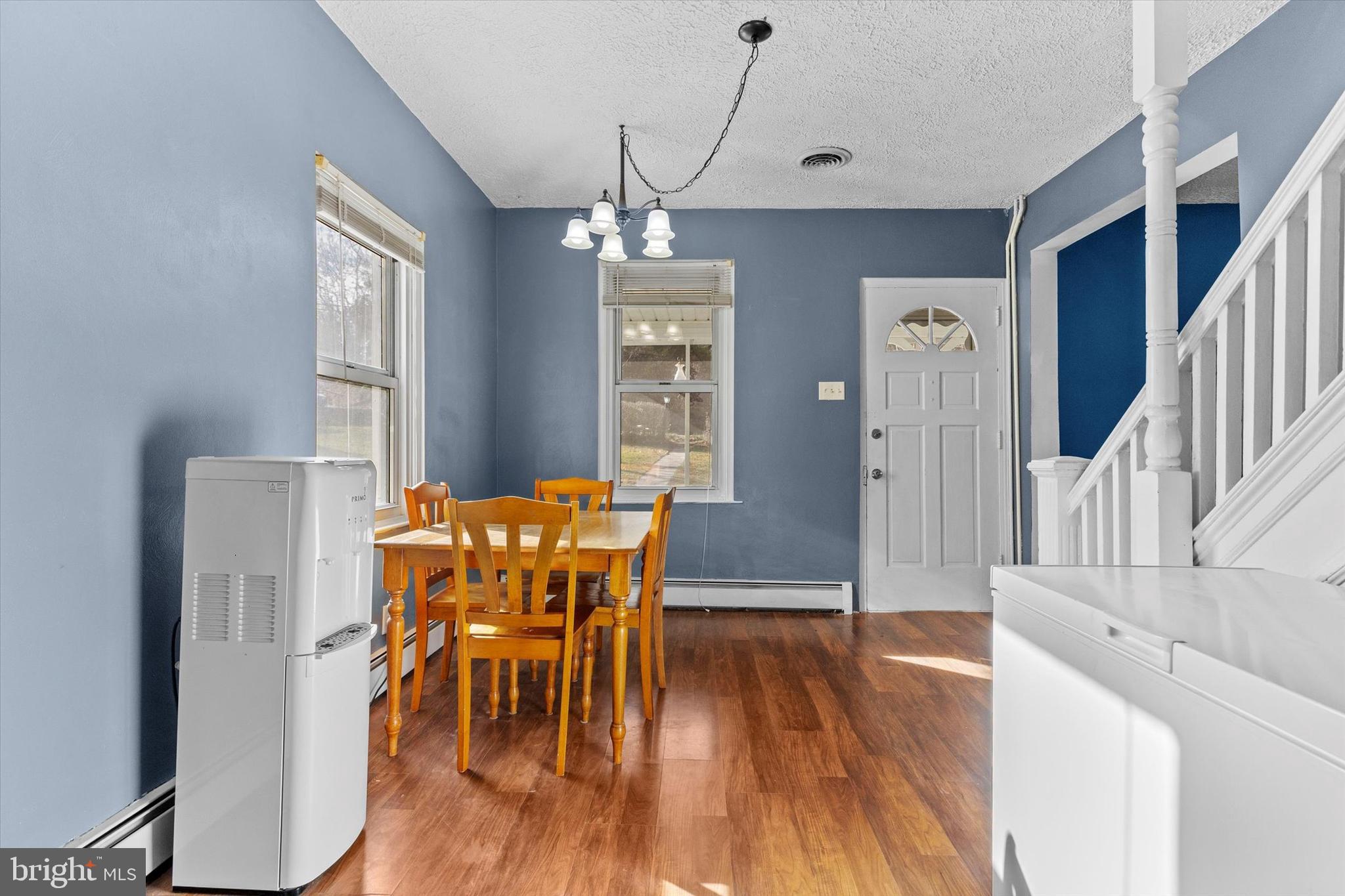 2689 Sheridan Road York, PA 17406 - Photo 22 of 28 a view of a dining room with furniture window and wooden floor
