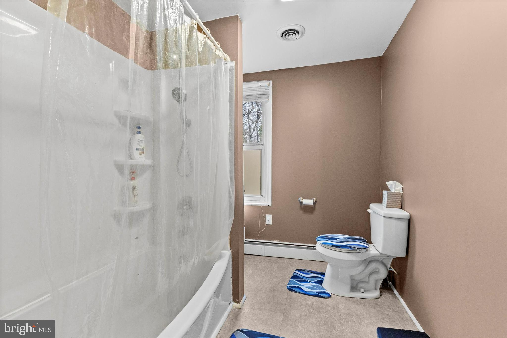 2689 Sheridan Road York, PA 17406 - Photo 8 of 28 a bathroom with a sink a toilet and shower