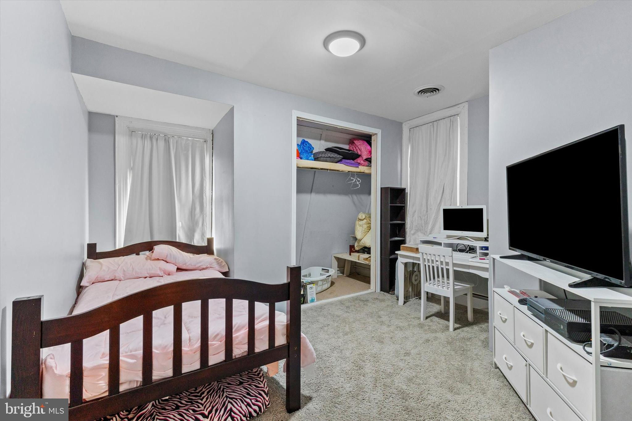 2689 Sheridan Road York, PA 17406 - Photo 10 of 28 a bedroom with furniture and a flat screen tv