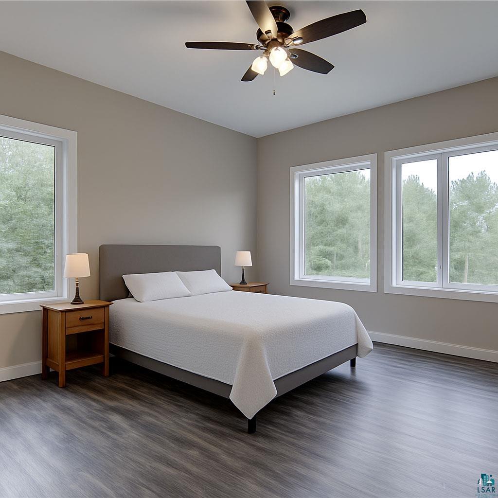 6030 Mitchell Road Iron River, WI 54847 - Photo 23 of 45 Bedroom featuring wood finished floors and ceiling fan