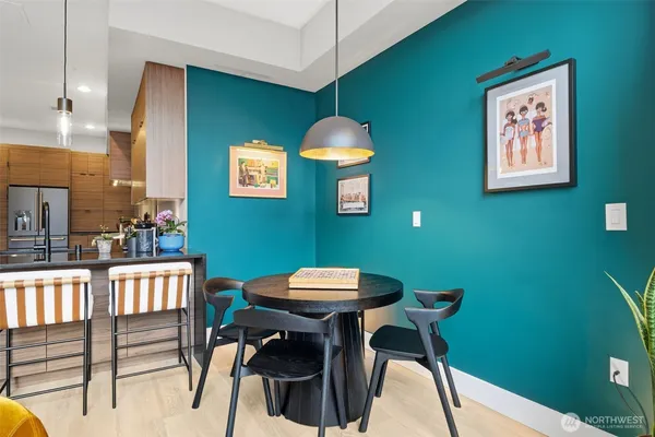 a view of a dining room with furniture and wooden floor