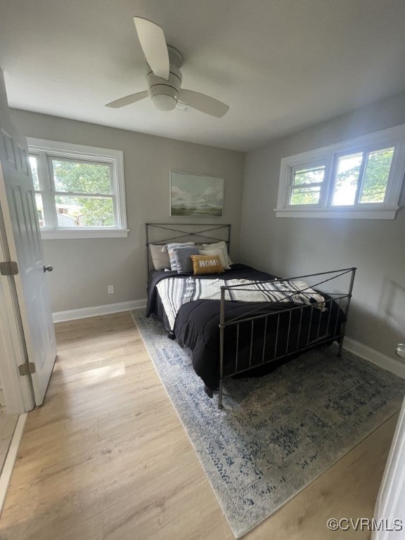 8306 Dade Road Richmond, VA 23227 - Photo 14 of 21 Bedroom with light wood finished floors and ceilin