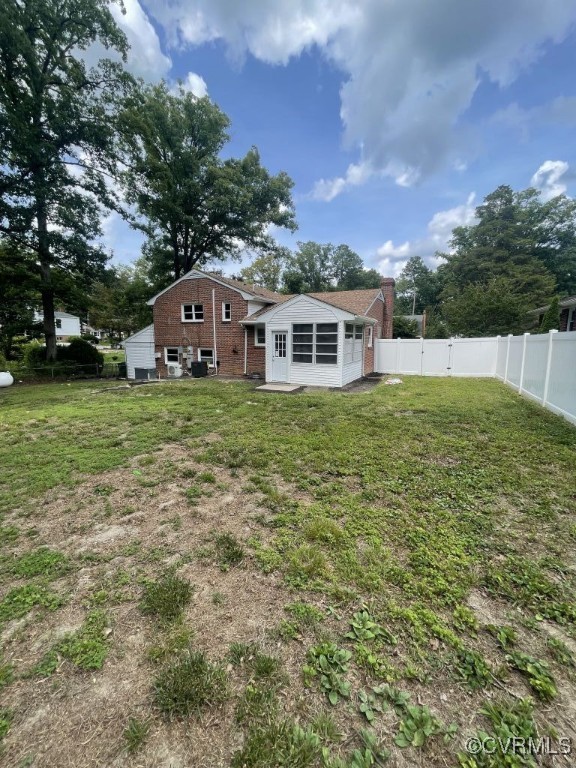 8306 Dade Road Richmond, VA 23227 - Photo 21 of 21 Back of house featuring a fenced backyard, a chimn