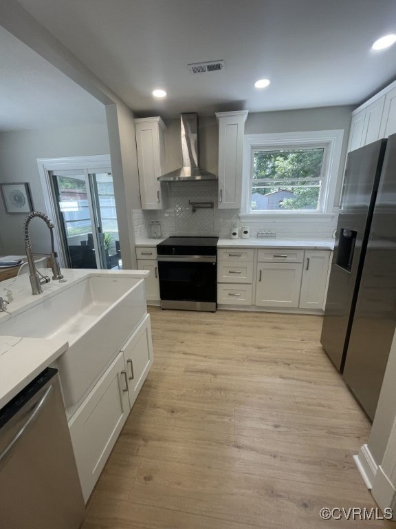 8306 Dade Road Richmond, VA 23227 - Photo 6 of 21 Kitchen with wall chimney exhaust hood, stainless