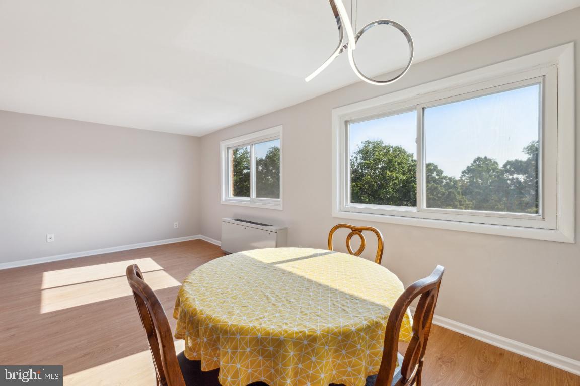 5101 8th Road South, Unit 310 Arlington, VA 22204 - Photo 7 of 28 a view of a dining room with furniture window and outside view