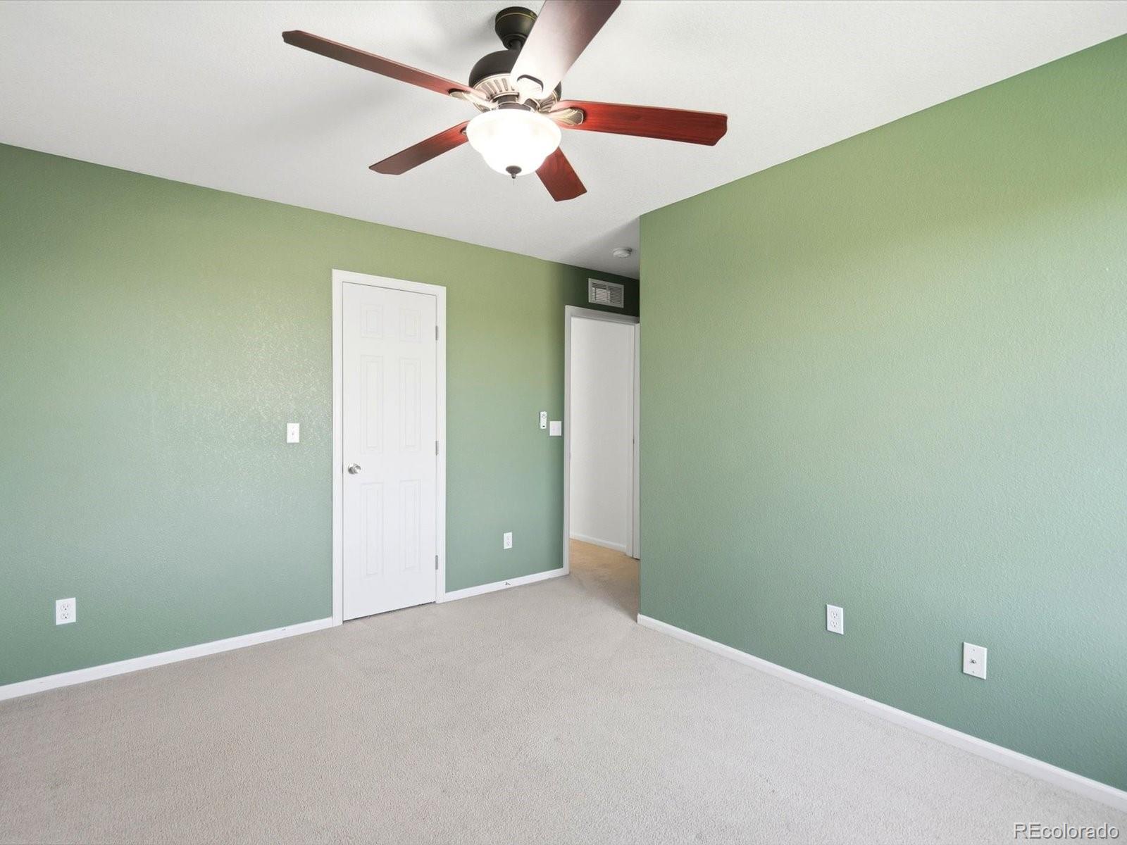 5444 Perth Court Denver, CO 80249 - Photo 35 of 46 a view of a room with a ceiling fan and a fan
