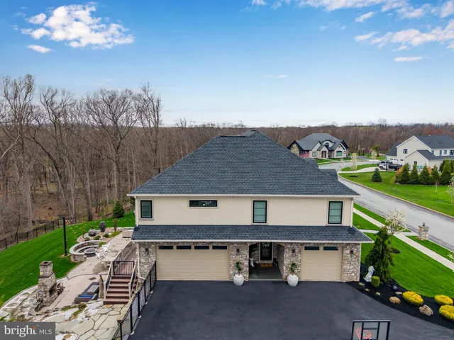 a view of a dining room with furniture a chandelier and wooden floor