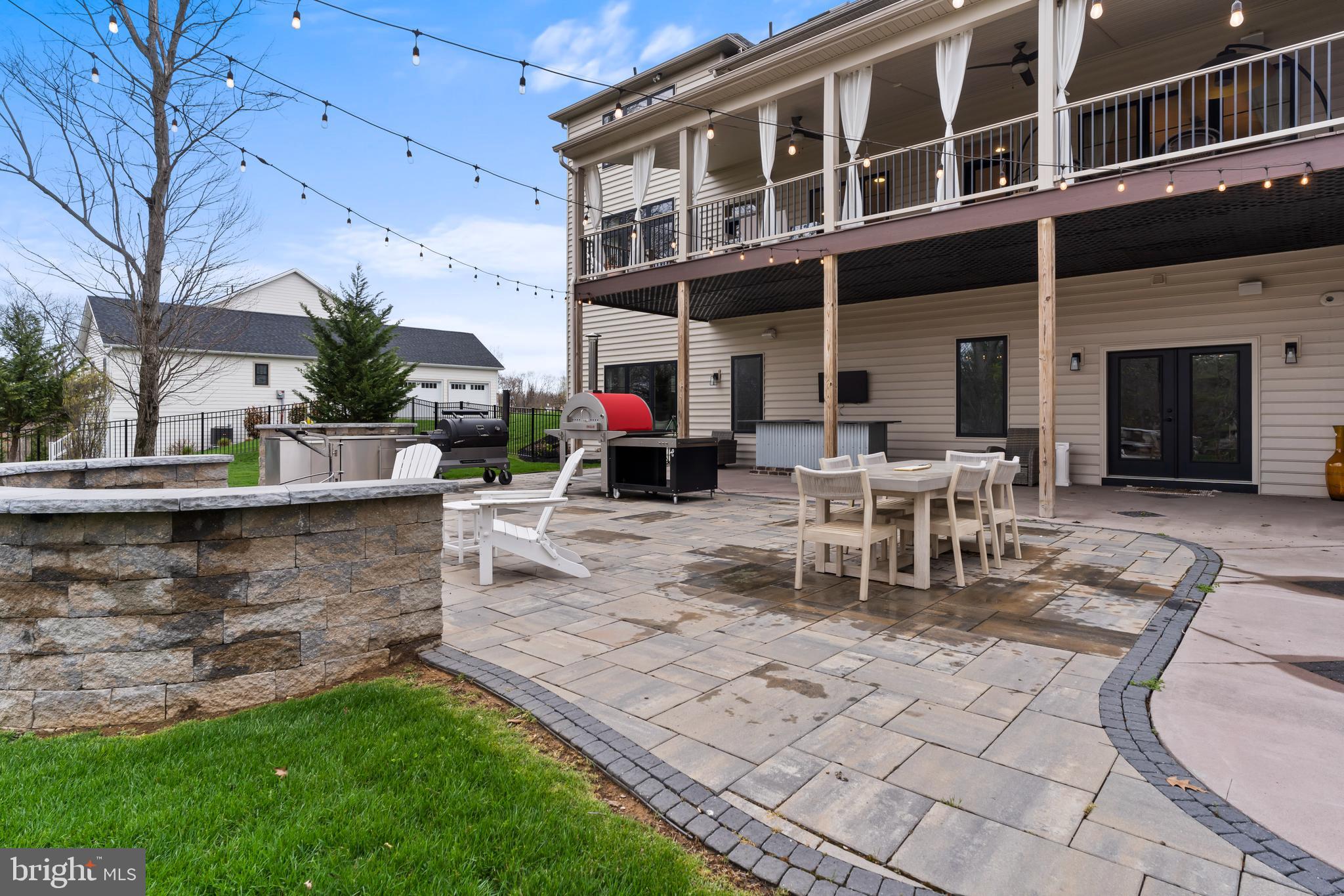 6522 Plowman Ridge Harrisburg, PA 17112 - Photo 21 of 117 a view of a patio with table and chairs and potted plants