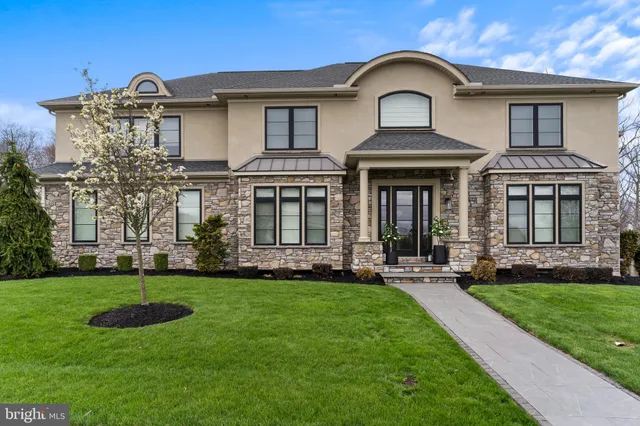 a large kitchen with a table and chairs