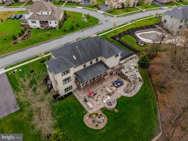 an aerial view of a house with a lake view