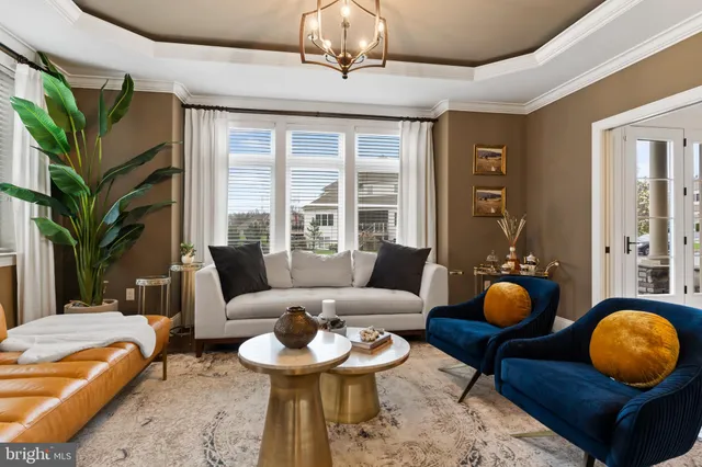 a work room with furniture and a chandelier