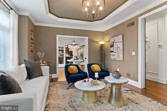 a spacious bedroom with a bed and a flat screen tv