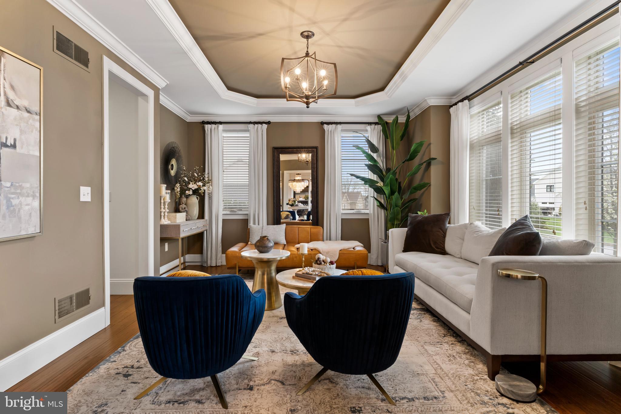 6522 Plowman Ridge Harrisburg, PA 17112 - Photo 35 of 117 a living room with furniture chandelier and a large window