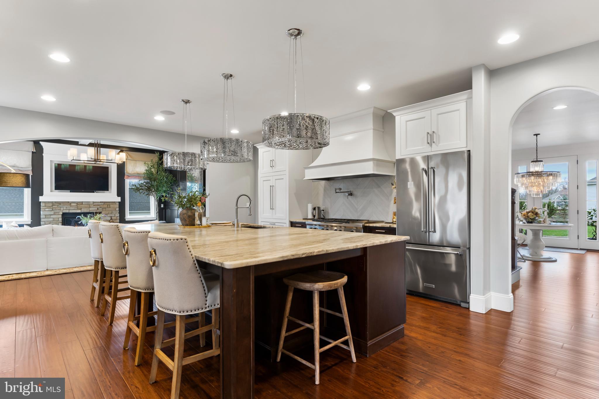 6522 Plowman Ridge Harrisburg, PA 17112 - Photo 40 of 117 a kitchen with stainless steel appliances granite countertop a table chairs stove and refrigerator