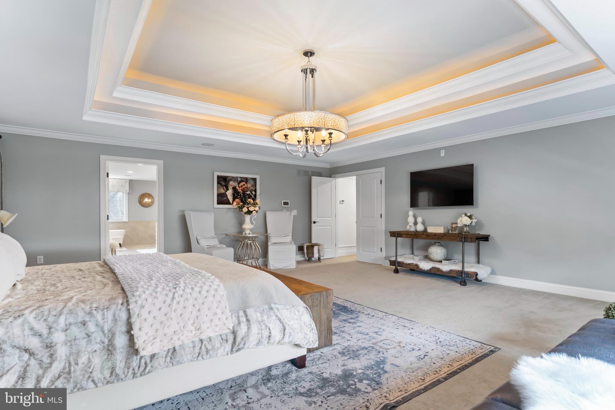 6522 Plowman Ridge Harrisburg, PA 17112 - Photo 70 of 117 a spacious bedroom with a bed and a flat screen tv