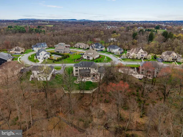 a front view of a house with garden and porch
