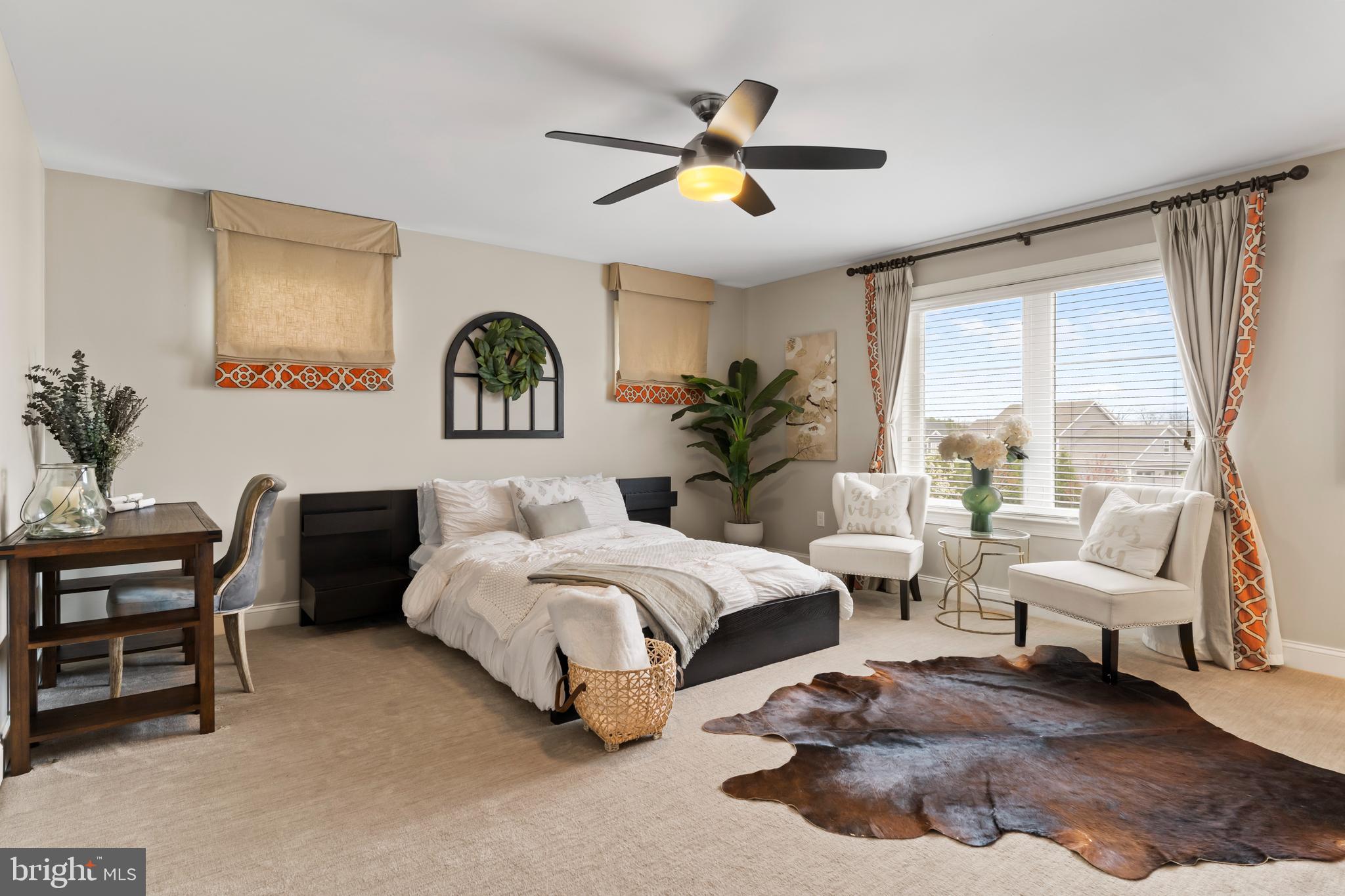 6522 Plowman Ridge Harrisburg, PA 17112 - Photo 81 of 117 a spacious bedroom with a bed and a couch