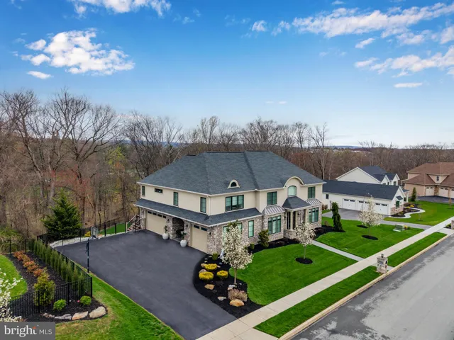 a view of a patio with table and chairs and potted plants