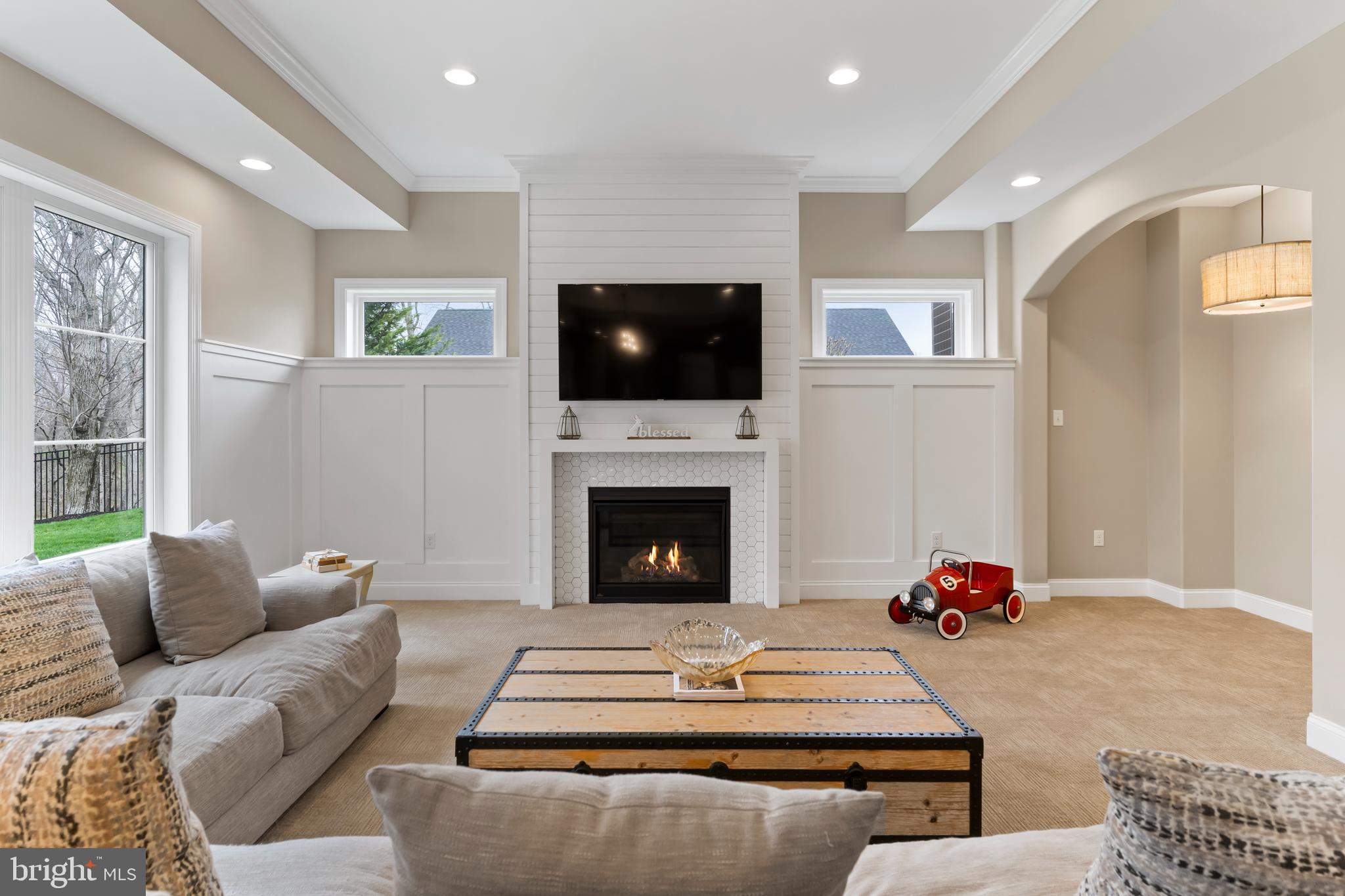 6522 Plowman Ridge Harrisburg, PA 17112 - Photo 97 of 117 a living room with furniture a flat screen tv and a fireplace