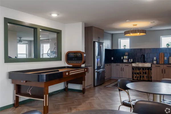 a living room with furniture a piano and a flat screen tv