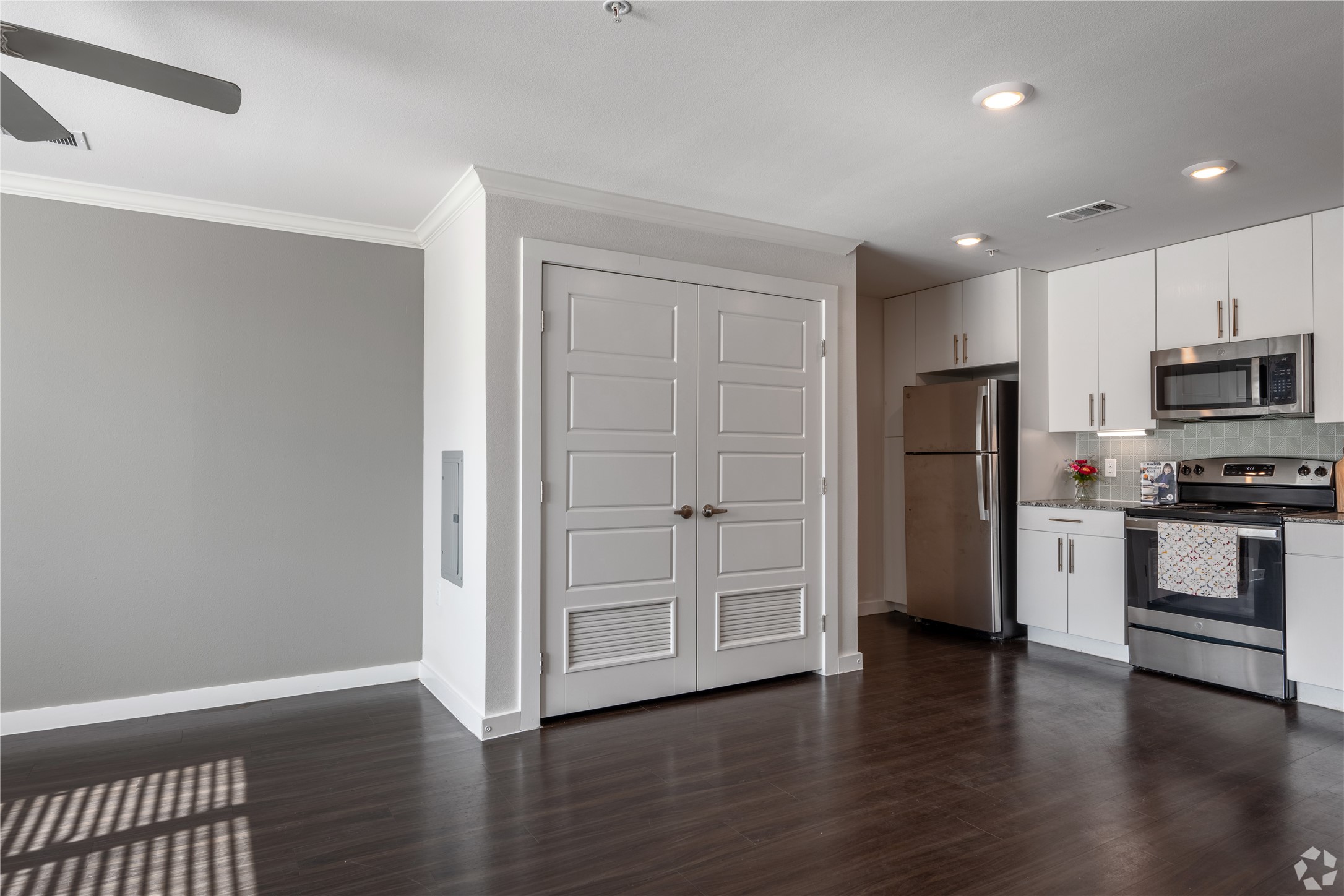 2401 East Oltorf Street, Unit 170 Austin, TX 78741 - Photo 4 of 14 a view of kitchen with wooden floor and electronic appliances
