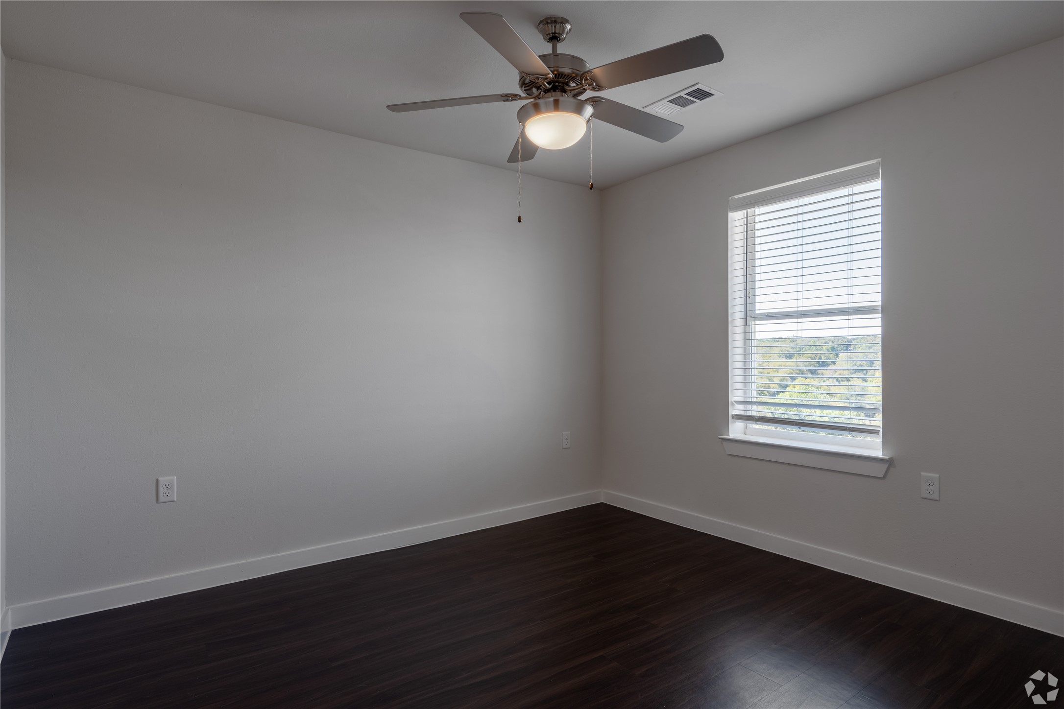 2401 East Oltorf Street, Unit 170 Austin, TX 78741 - Photo 8 of 14 a view of an empty room with wooden floor and a window