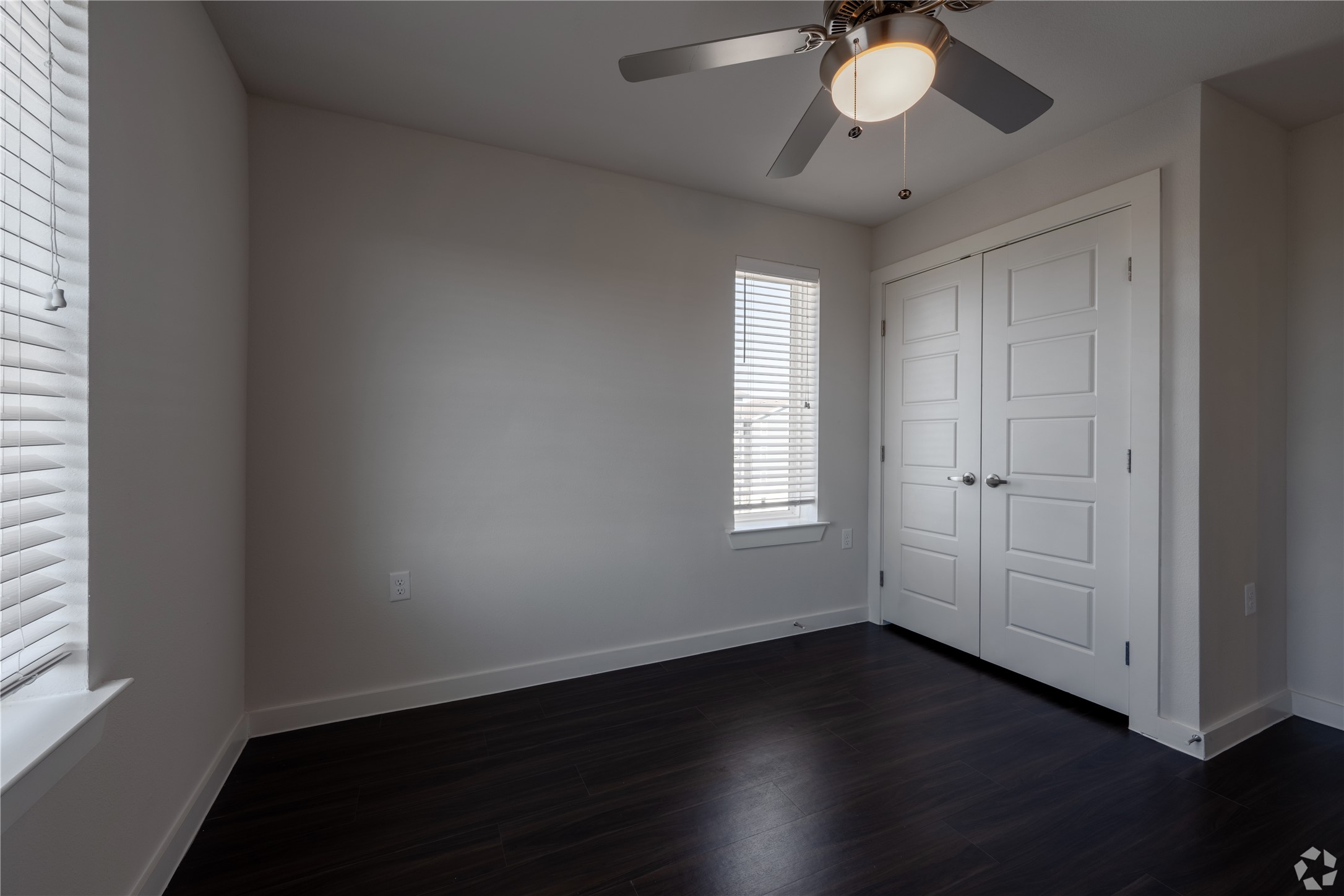 2401 East Oltorf Street, Unit 170 Austin, TX 78741 - Photo 10 of 14 an empty room with wooden floor and windows